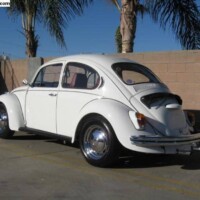 Car features replacement upholstery colour, aftermarket steering wheel and front spoiler not part of the original edition package.