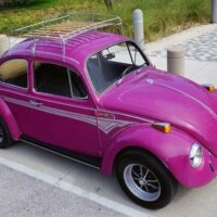 Glitter Bug painted in Royal Glow with the metallic silver Zandvoort Streaks Stripe package.