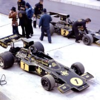 Two Lotus 72E ( Ford-Cosworth DFV, 2993cc V8, mid-engined, longitudinally mounted) of Ronnie Peterson (1) and Jacky Ickx (2). Colin Chapman next to the photographer. 1974 United States Grand Prix, Watkins Glen.