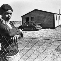 Winnie Madikizela-Mandela during her exile in Brandfort, South Africa with her Lux Bug, 1977. Photo By Peter Magubane. Winnie Mandela