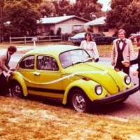Ravenna Green. This car has an additional wide black band along the side which appears to be an owner applied decorative customisation.