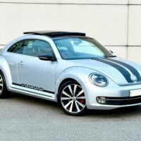 A Reflex Silver Turbo Black with optional panoramic glass sunroof, bi-xenon headlights and 2 stripe design decorative film.